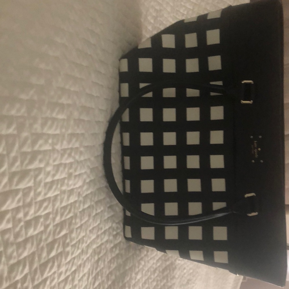 Kate Spade bag NWOT, black/cream w/ slight defect on the bottom as pictured